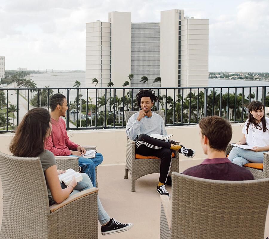 PBA students sit in a circle and talk.